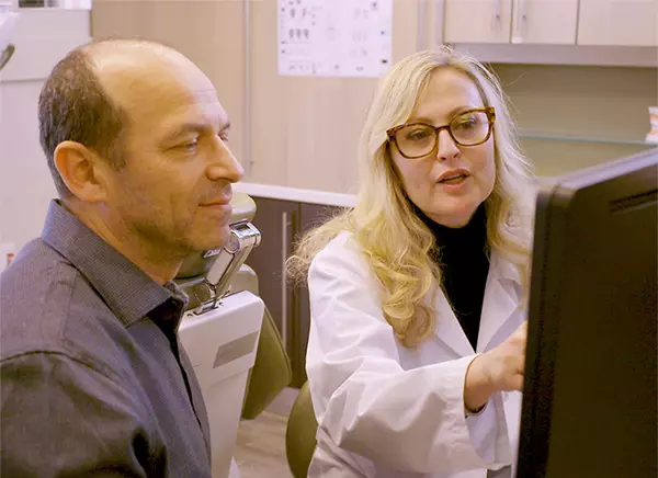 Dr. Ostrovsky Consulting with a Patient