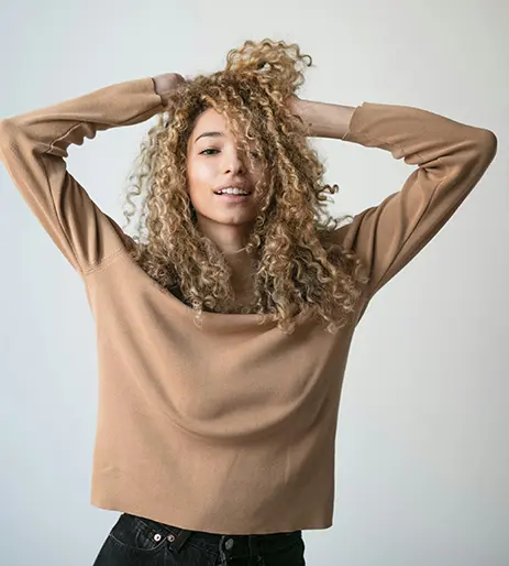 Girl Looking At Camera Hands In Hair
