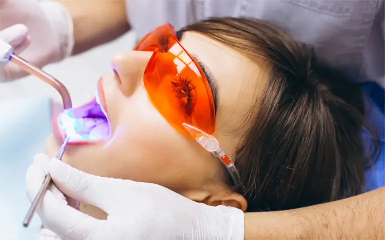 Woman Getting Treated With Laser Dentistry 2